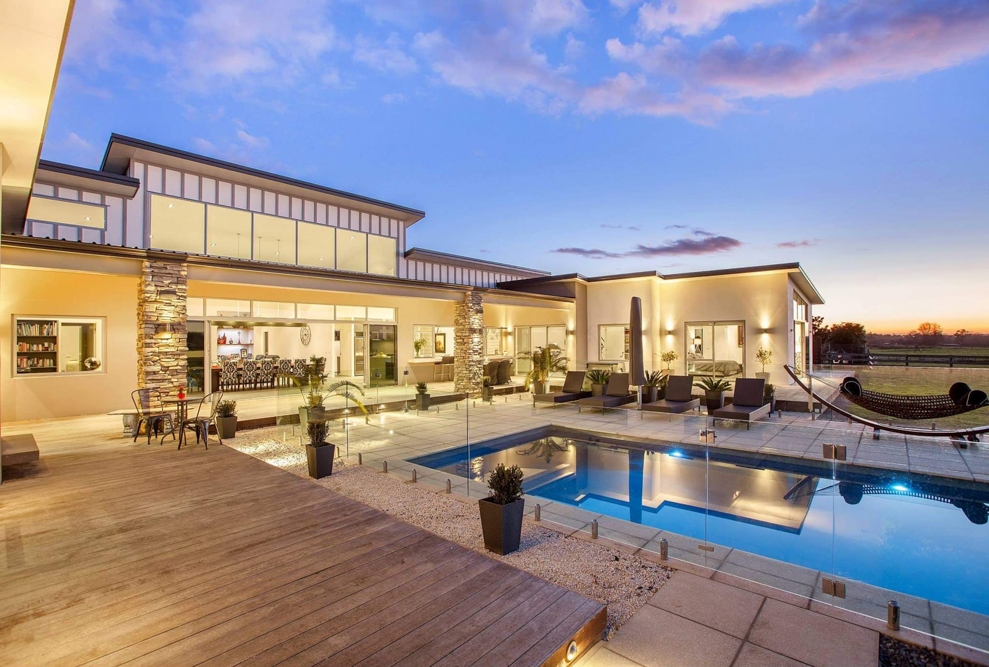 Rear view of a home and pool