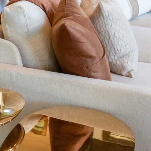 Sofa with gold side tables