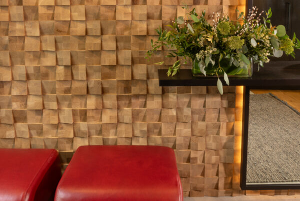 Textured wall with flowers and red ottomans